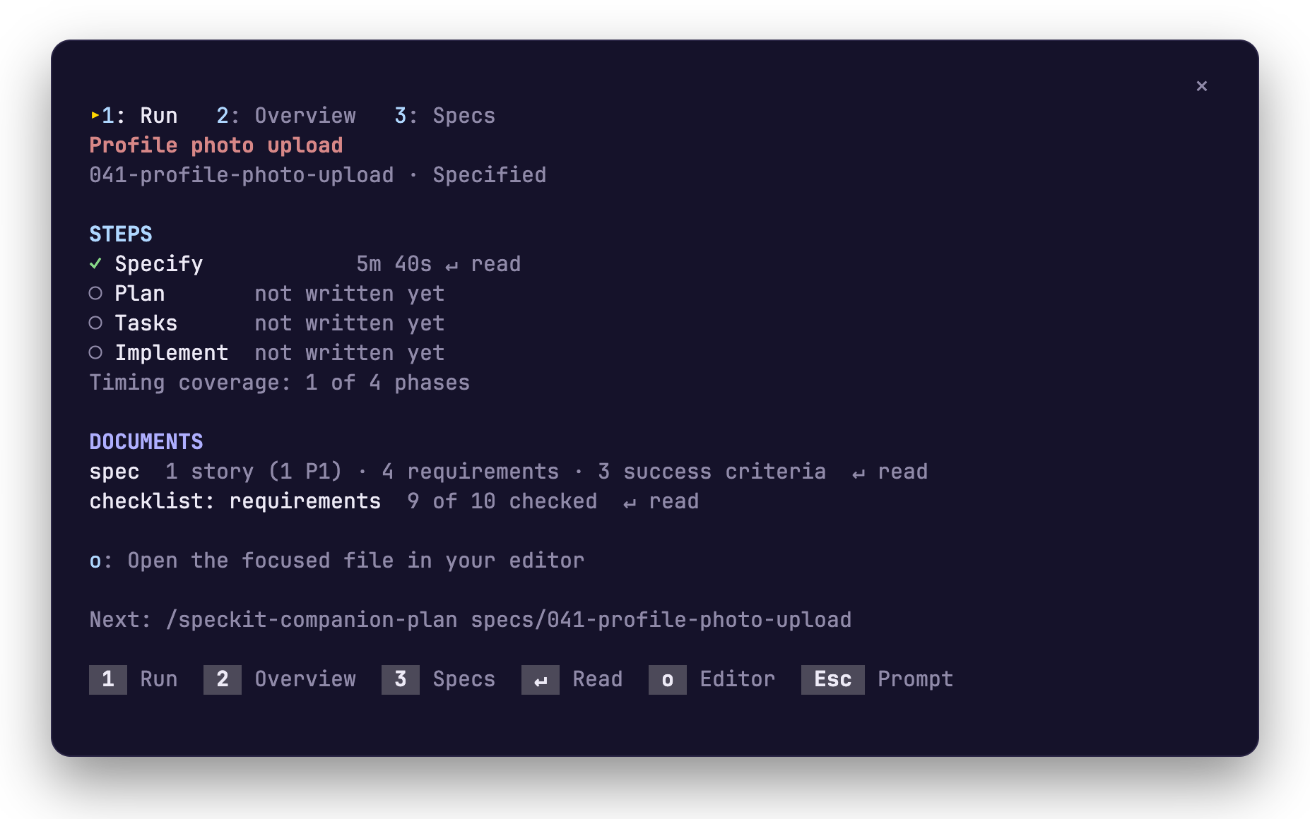 The pane after specify. The status reads Specified, Specify is ticked with 5m 40s, Plan, Tasks and Implement read not written yet, the documents are the spec and its checklist, and the last line reads Next: /speckit-companion-plan specs/041-profile-photo-upload.