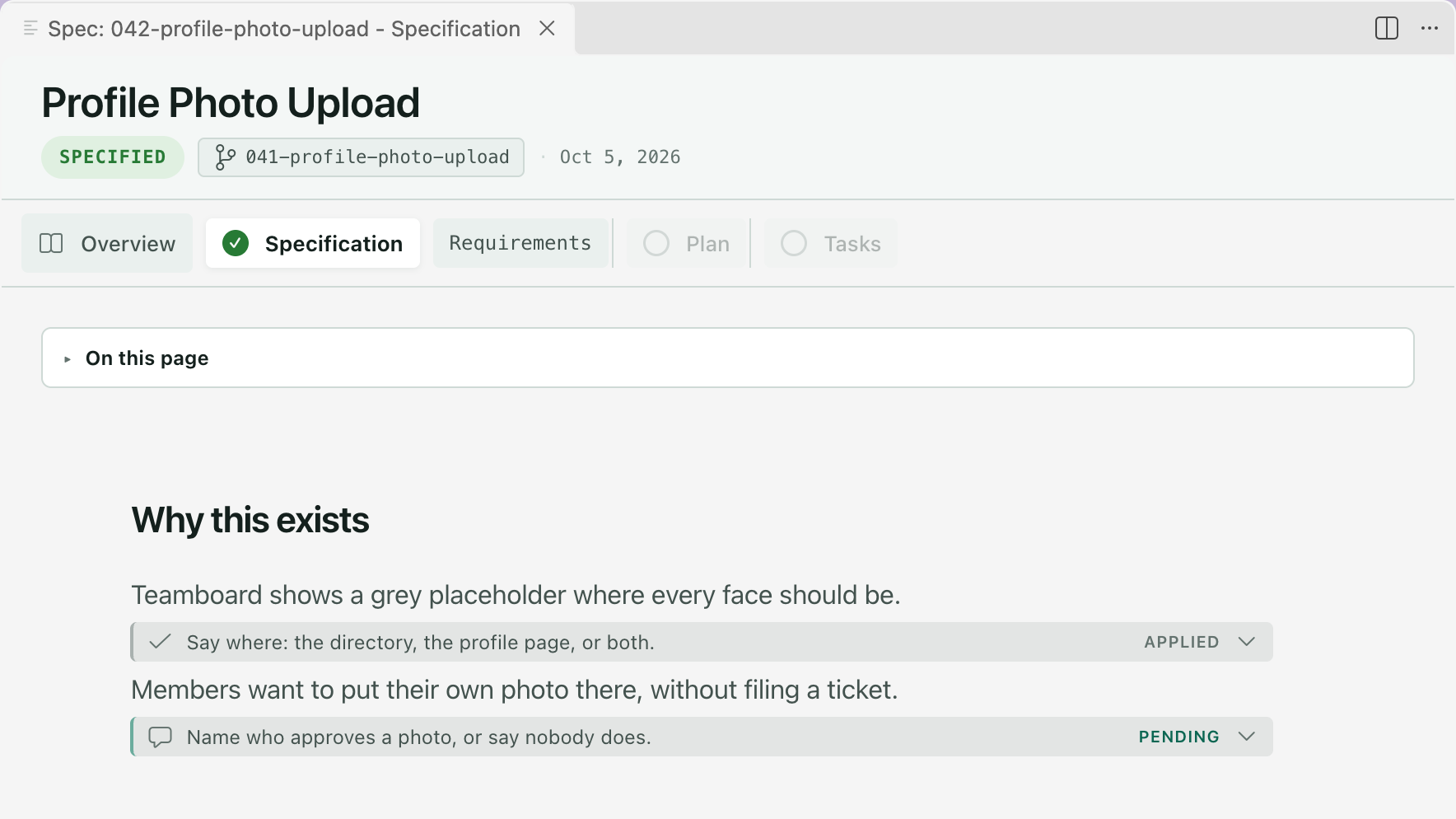The Specification tab of Profile Photo Upload with two comment cards under Why this exists. The first, under the first paragraph, reads Applied. The second, under the second paragraph, reads Pending.
