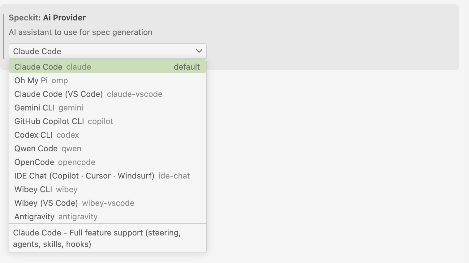 The Speckit: Ai Provider setting with its dropdown open on twelve assistants, from Claude Code, the default, through Oh My Pi, Gemini CLI, GitHub Copilot CLI and Codex CLI to Antigravity, with a line describing the highlighted one.