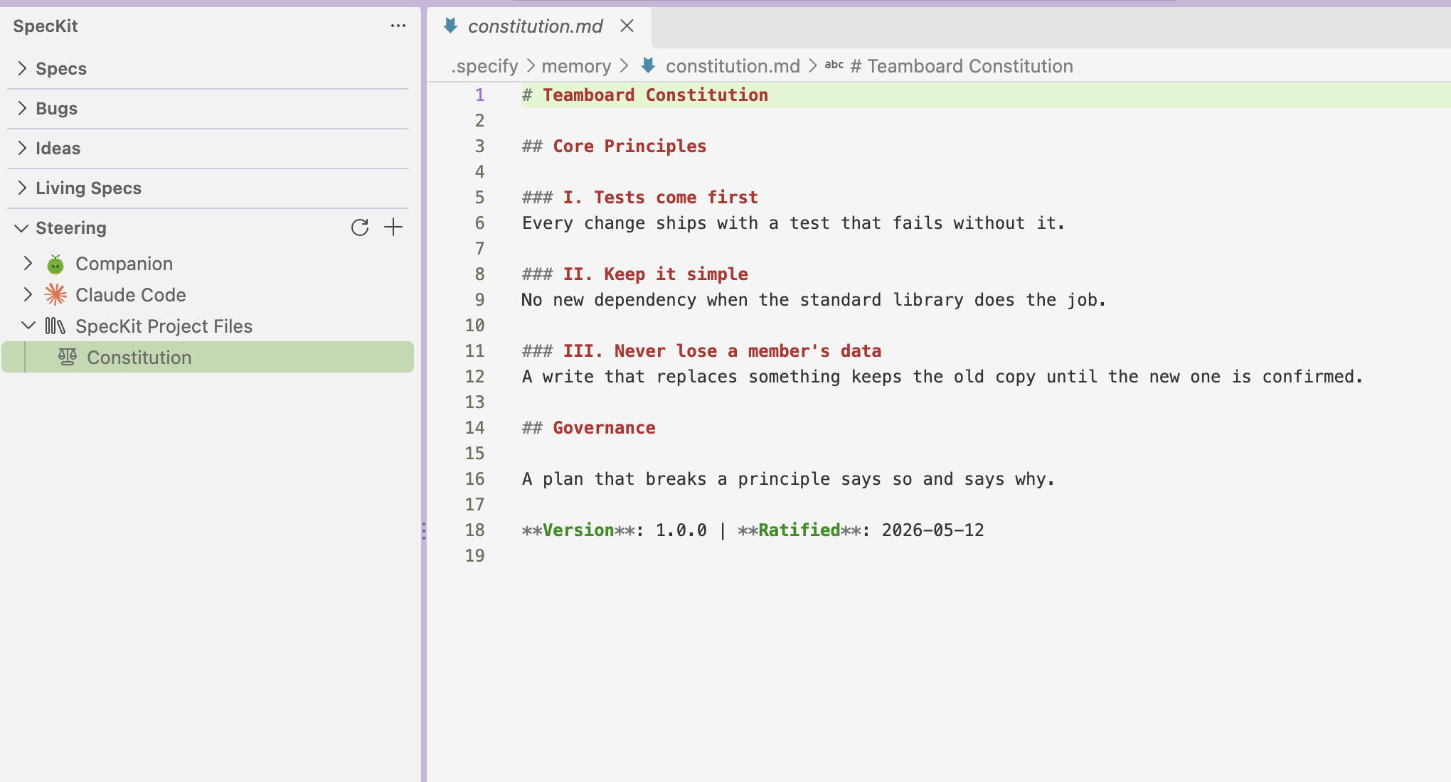 The SpecKit side bar with the Steering view open on Companion, Claude Code and SpecKit Project Files. Constitution is selected under SpecKit Project Files, and constitution.md is open beside it with three principles and a Governance section.